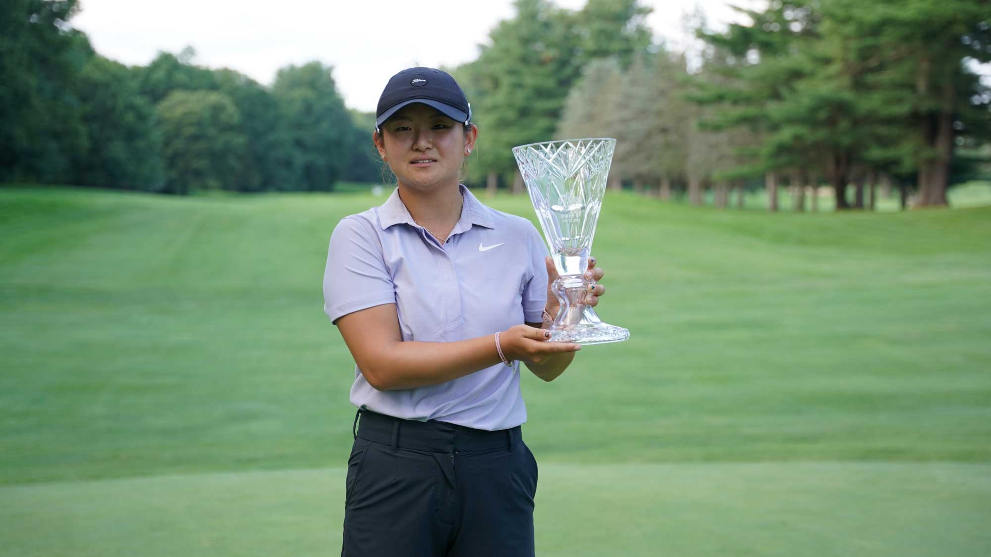 Jenny Bae with the trophy