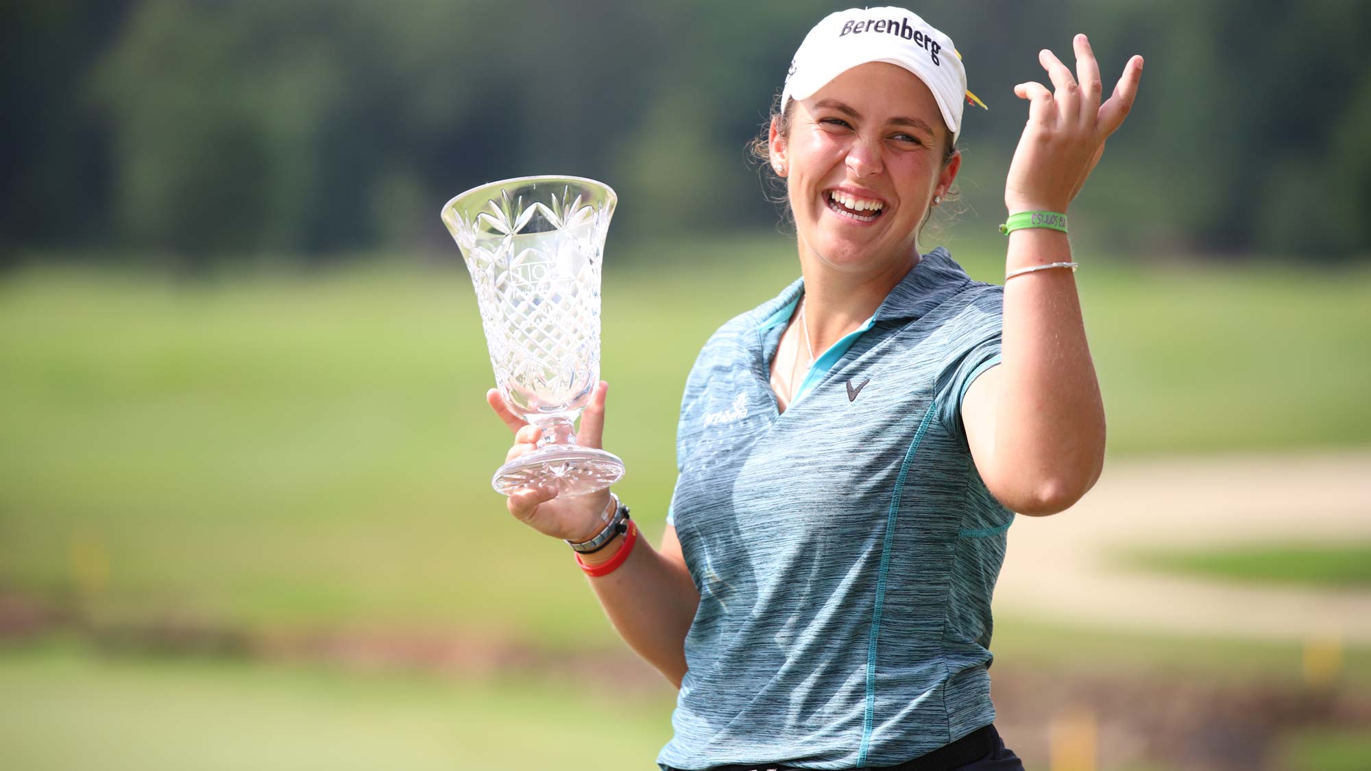 maria-parra-laughs-with-trophy.jpg