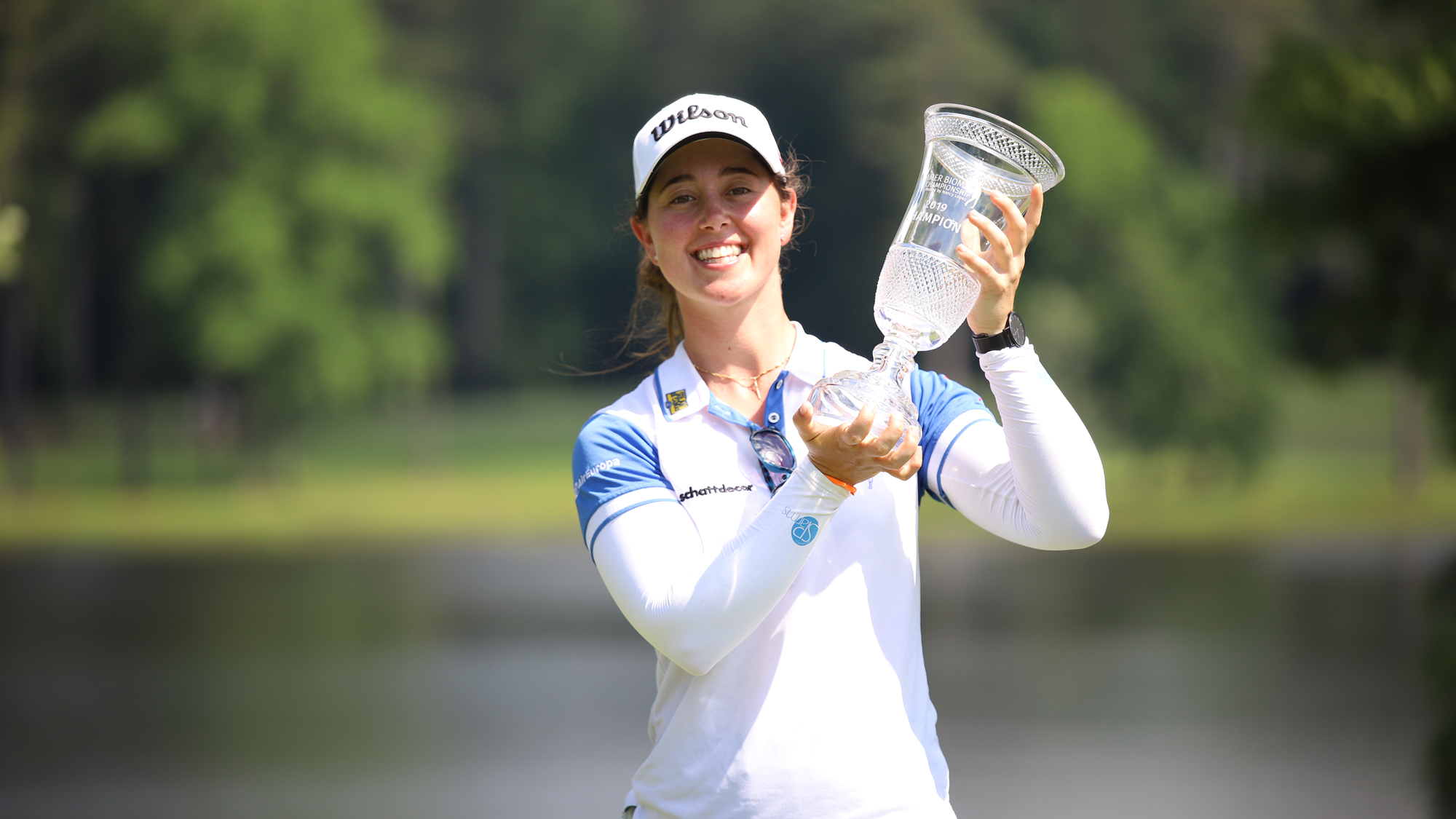 Nuria Iturrios holds trophy