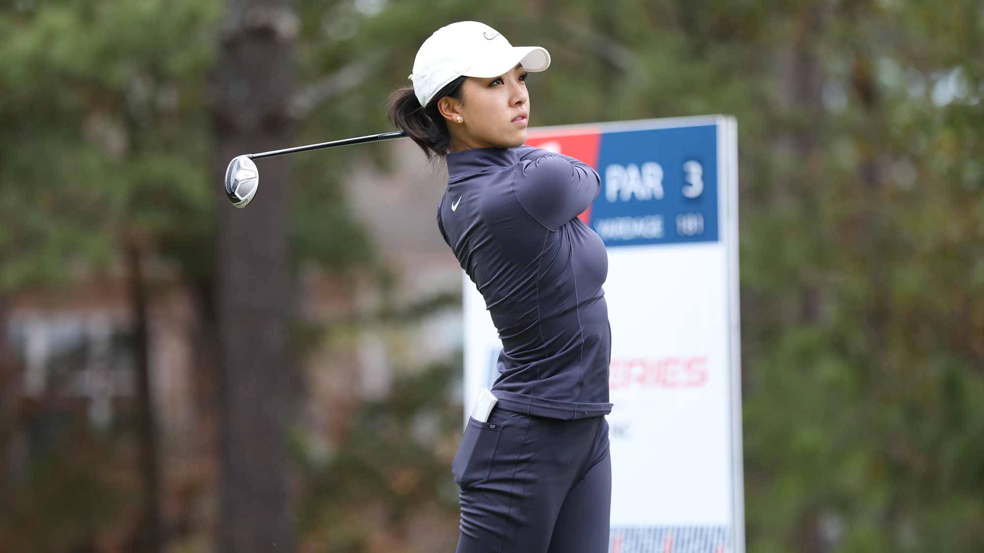 Muni He watches her tee shot at the par 3 16th hole at Pinehurst No. 6 during the fourth round of the 2019 LPGA Q-Series at Pinehurst Resort